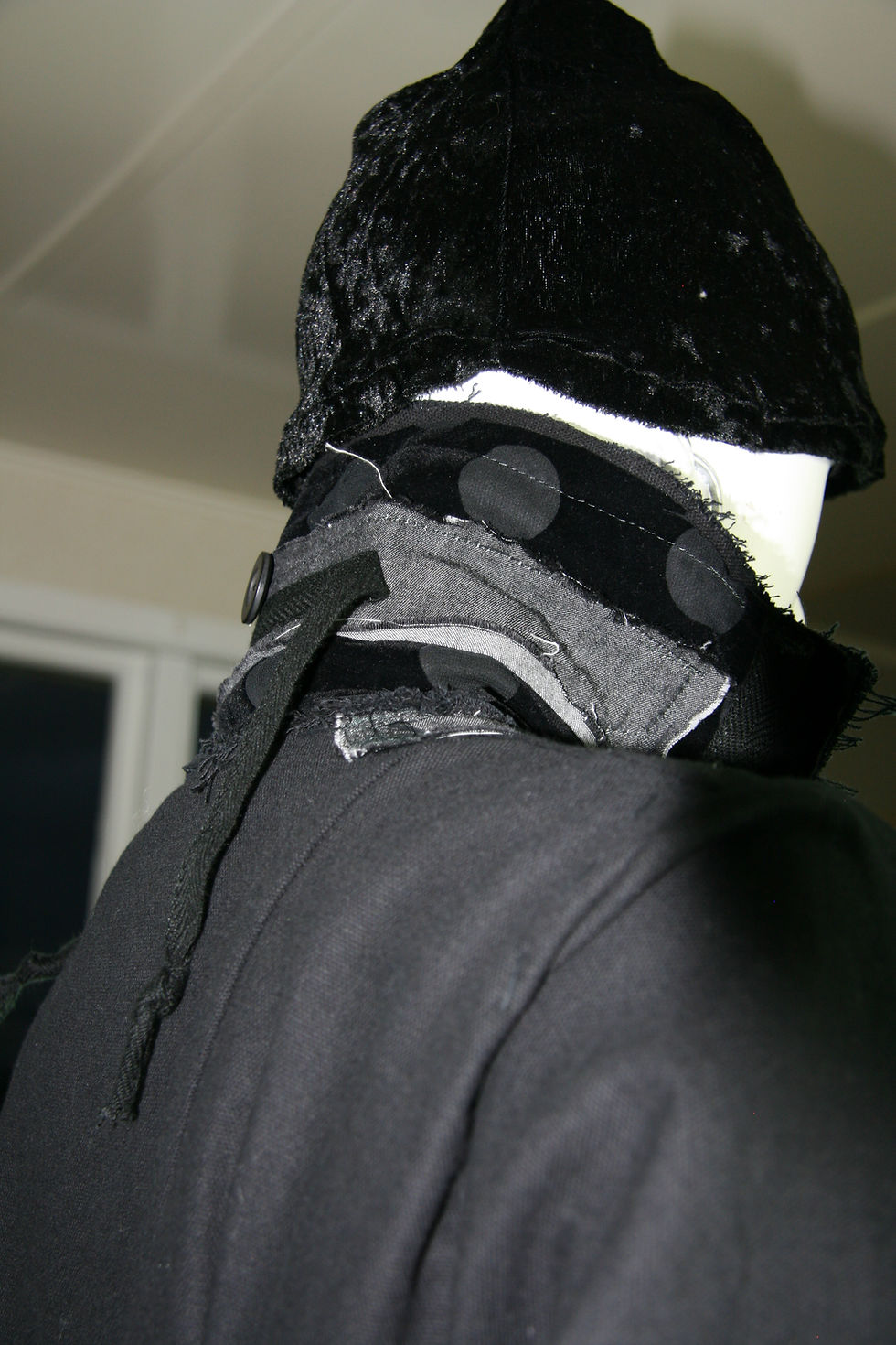 Thumbnail: Back of Variation 2 of DIS-STRESSED COATshowing unique decinstruct collar