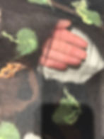 Orange Blossom Ladar Scarf with hand showing transparency of silk windows