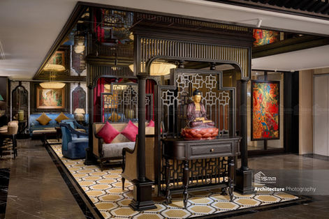 Không gian lounge phong cách Đông Dương với tượng Phật trang trí tại khách sạn Tonkin Hà Nội.