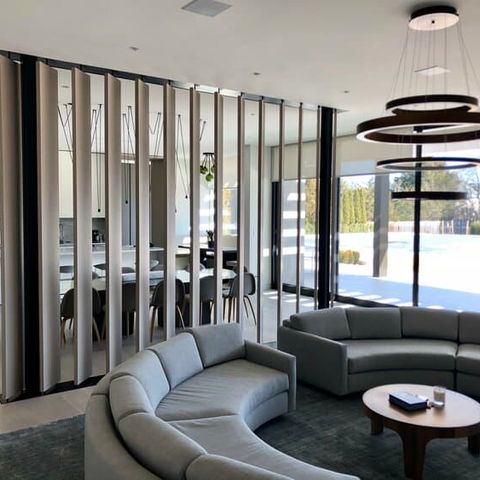 a living room with a curved couch and a table