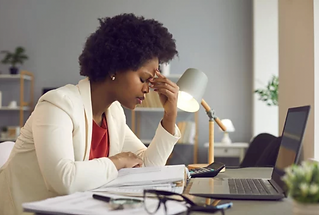 Woman looking stressed in front of computer