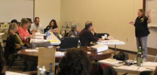 Certified Educator Cindy Dvergsten explaining financial management to Mora Co-op growers.