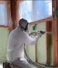 Spray foam insulation applied in attic to improve energy efficiency in Toronto home