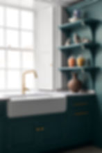 Photograph of a teal utility room with custom cabinetry and gold detailing, featuring a large belfast sink.