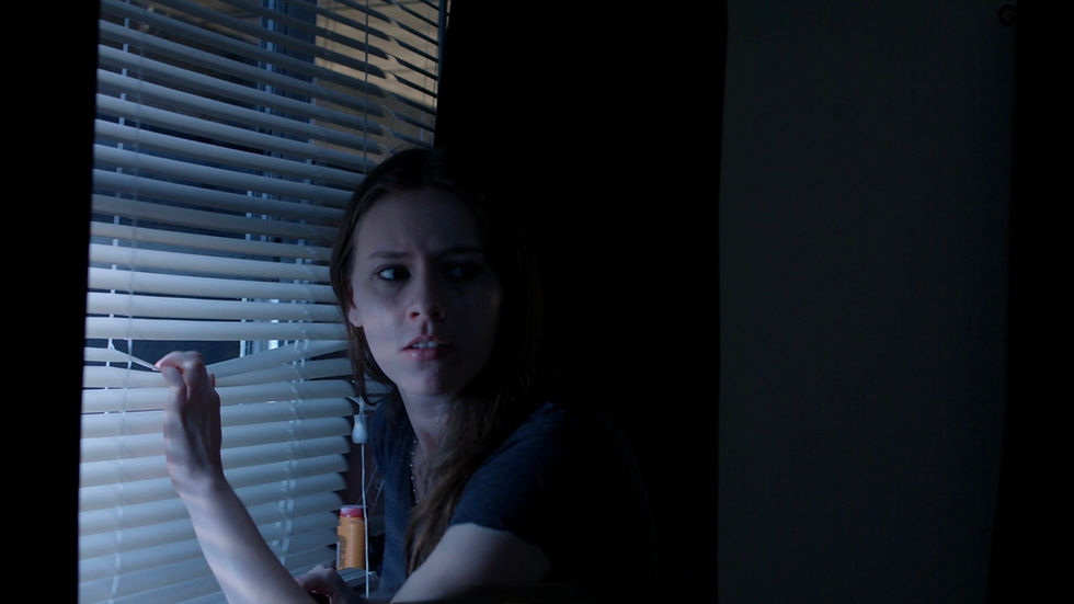 Victoria Nelson bruised and frightened in a dramatic still from Trapped.