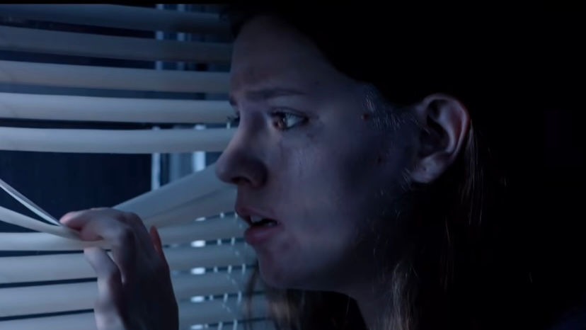 Victoria Nelson bruised and frightened in a dramatic still from Trapped.