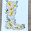 Thumbnail: Video showing a pressed flower giclee print of a floral Wellington boot in yellow and blue spring flowers