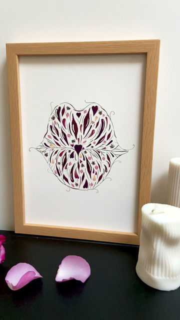 Thumbnail: A staged video showing a framed giclee print of a pair of puckered lips created from pressed red and pink rose petals