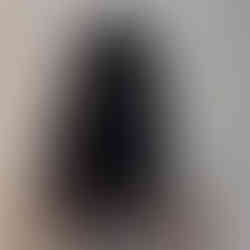 After curly hair extensions back view with added length and volume using 50cm natural curly hair, seamless blend