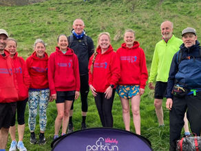 Group of runners on grassy hillside