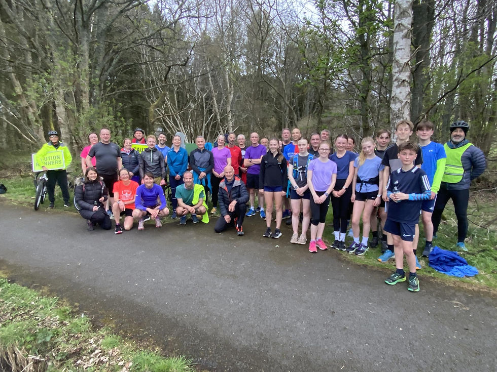 Large group of runners on a tarmac path