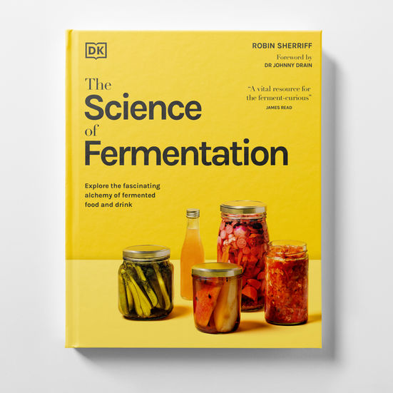 The Science of Fermentation cover featuring a still-life of a jar of dill pickles, a glass bottle of kombucha, a jar of pickled pears, a jar of pickled vegetables and a jar of kimchi