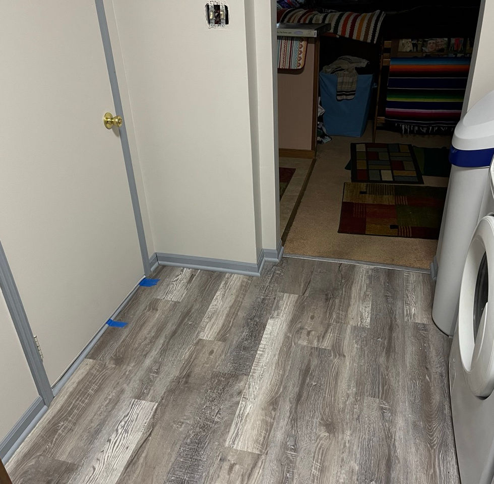 Painted door, finish trim at garage door transition.