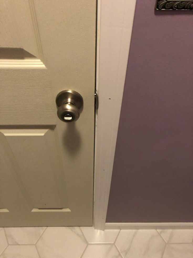 Door installation between main bath area and lavatory.