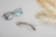 stylish-eyeglasses-over-pastel-background-optica-2021-08-30-12-08-36-utc.jpg