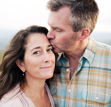 happy couple wearing hearing aids.jpg