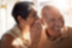 Elderly couple gossip and laugh