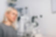 woman sitting with an optician in penrith and having her eyes tested