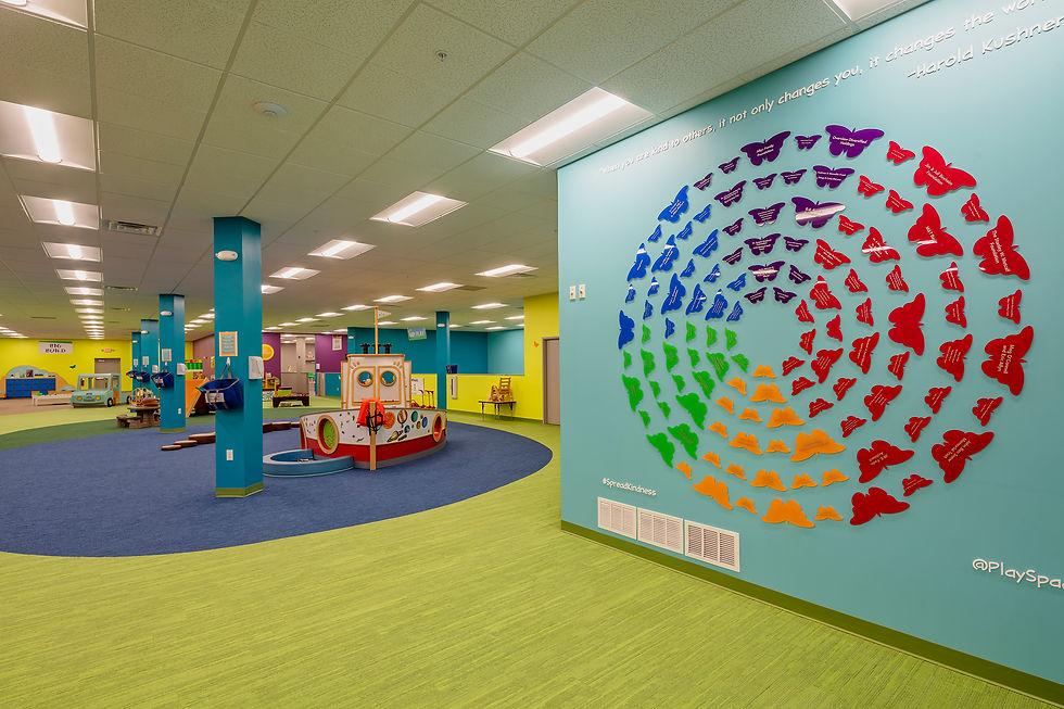 Community play space featuring colorful, custom-designed elements for children and families.