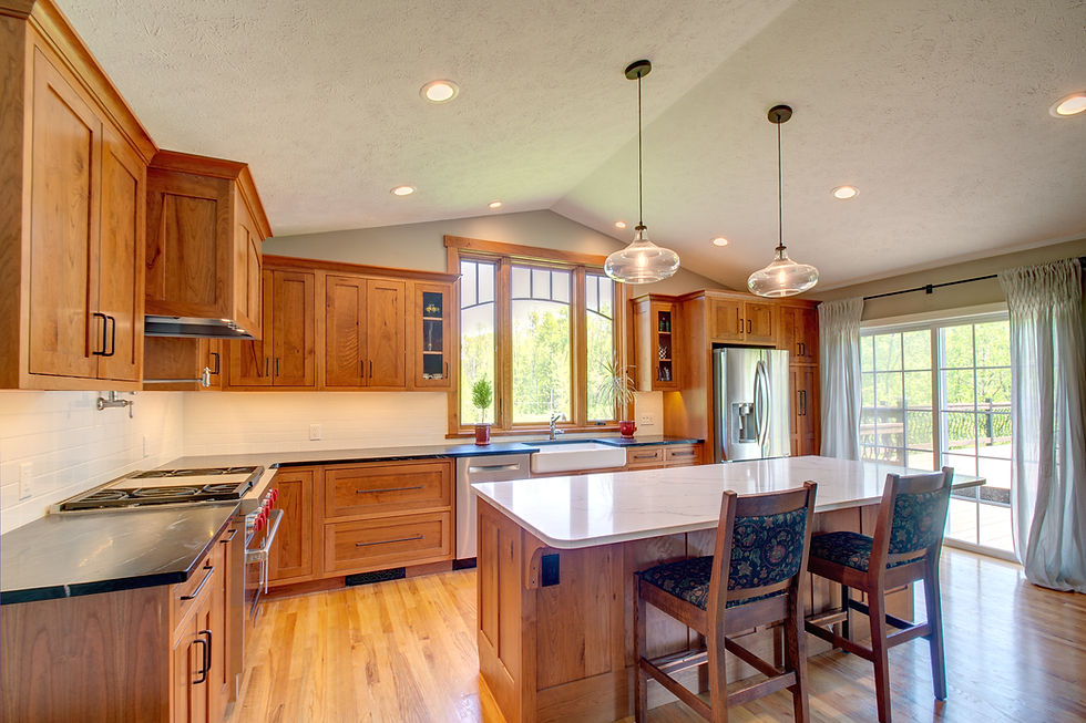 Craftsman-style residential kitchen featuring natural wood cabinetry and thoughtfully selected finishes.