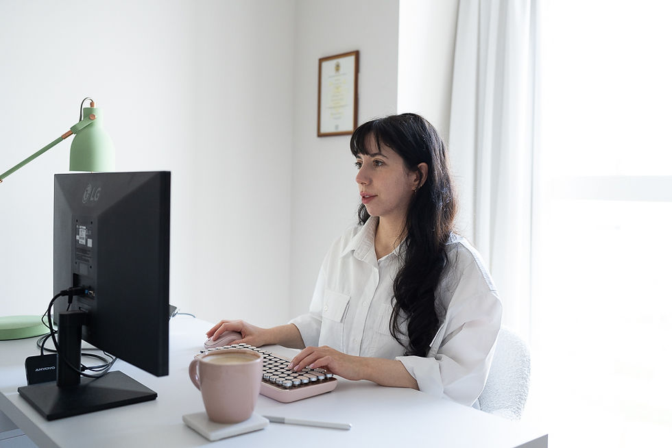 Photo of Beverley from Coached by Beverley sat at a computer