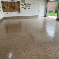 Polyaspartic flake coating on the interior of a residential garage finished by Rescue Concrete of Springfield, Illinois