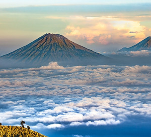 Experience the thrill of climbing Mount Kilimanjaro in Tanzania, home to the iconic peaks of Kibo and Mawenzi