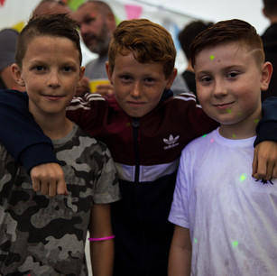children posting for photo at party