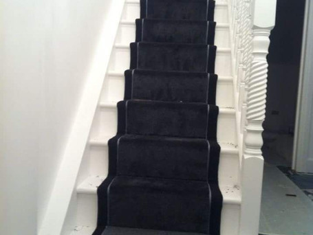 dark carpet on white staircase.jpg