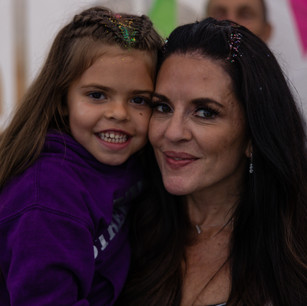 mother and daughter posing for camera