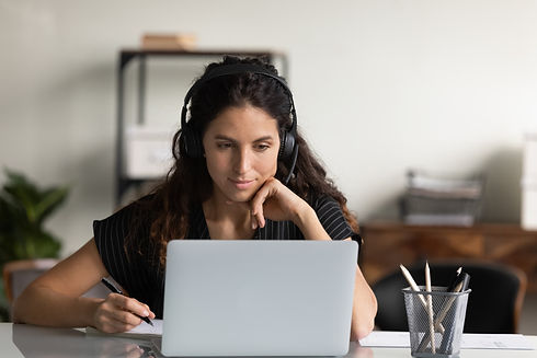 A woman studying on her laptop