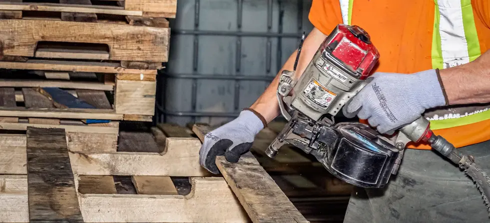 Pallet Repair - man w nailgun