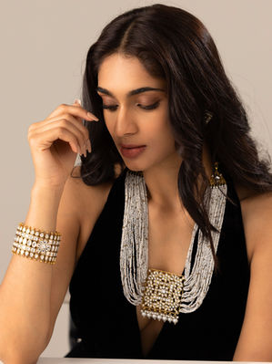 Discover the epitome of elegance with our luxurious gold-plated Kadas, exquisitely adorned with authentic Polki stones and intricate meenakari craftsmanship. Each set is a masterpiece, handcrafted by skilled artisans who blend traditional artistry with contemporary design to create jewelry that’s perfect for weddings, festivals, and special occasions.
Our Kada bangles feature:
Polki stones for a timeless, royal sparkle
Detailed meenakari work showcasing vibrant colors and fine enamel artistry
Rich gold plating that enhances durability and adds a premium finish
Handmade craftsmanship ensuring uniqueness and flawless quality
A bold yet elegant look, perfect for bridal wear, festive celebrations, or gifting
Elevate your ethnic jewellery collection with these statement bangles that radiate heritage and luxury in every detail.