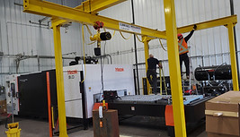 a workstation crane being erected in a warehouse