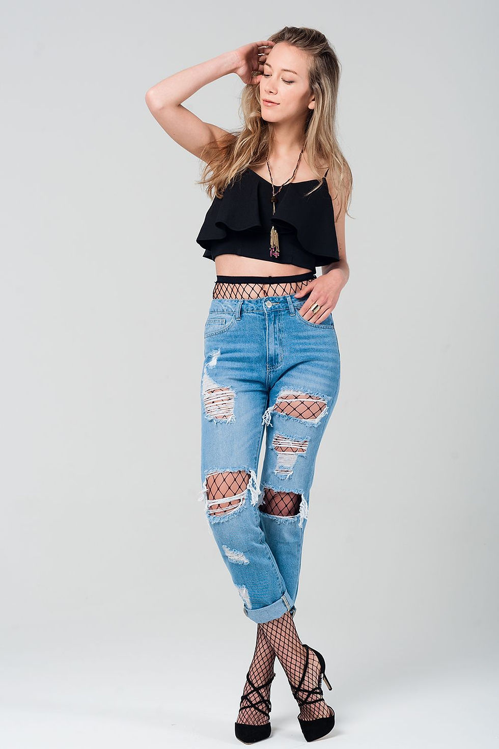 Thumbnail: Ripped Mom Jeans With Fishnet Tights