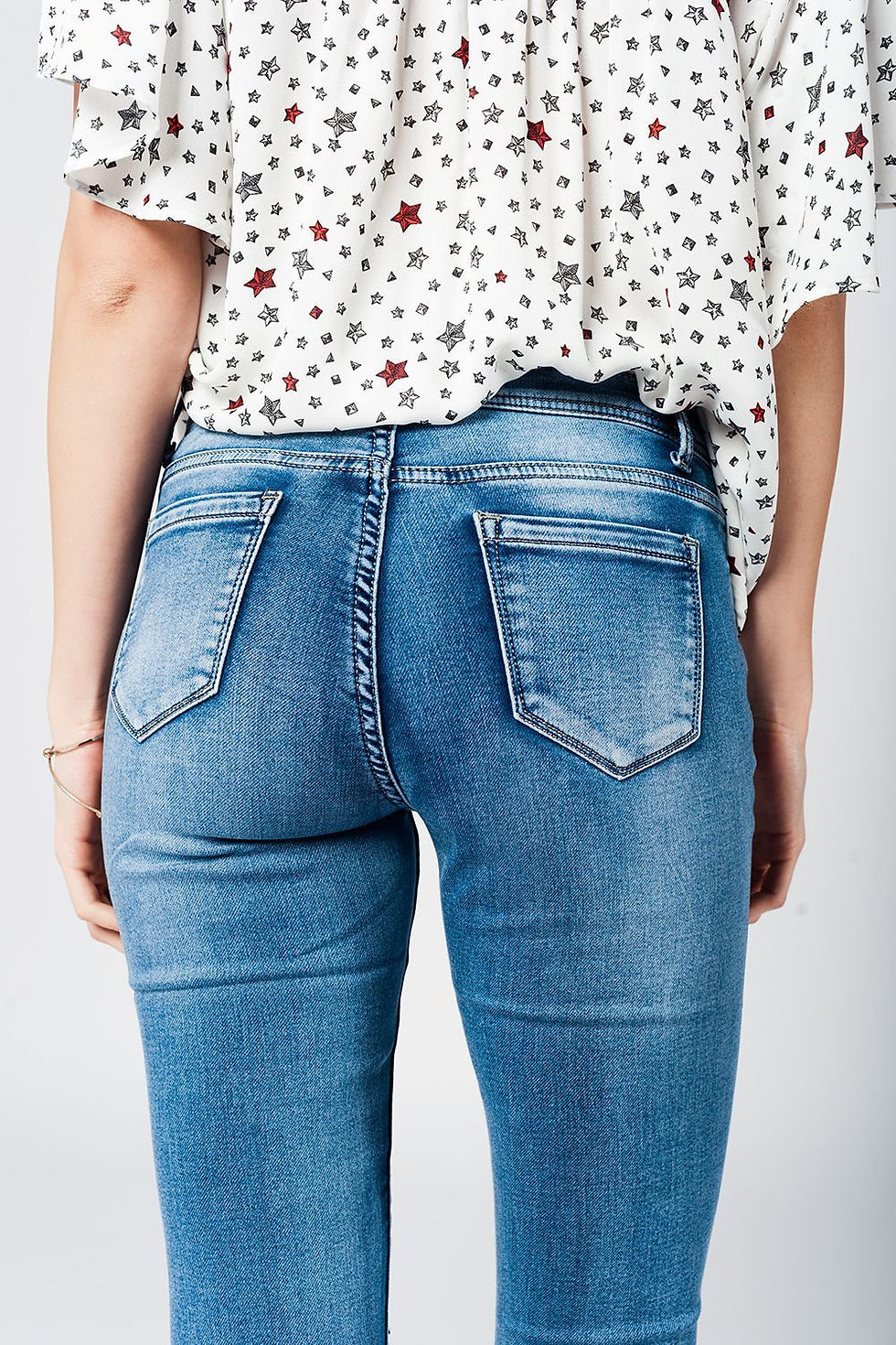 Thumbnail: Skinny Jeans in Midwash With Busted Knees and Chewed Hems