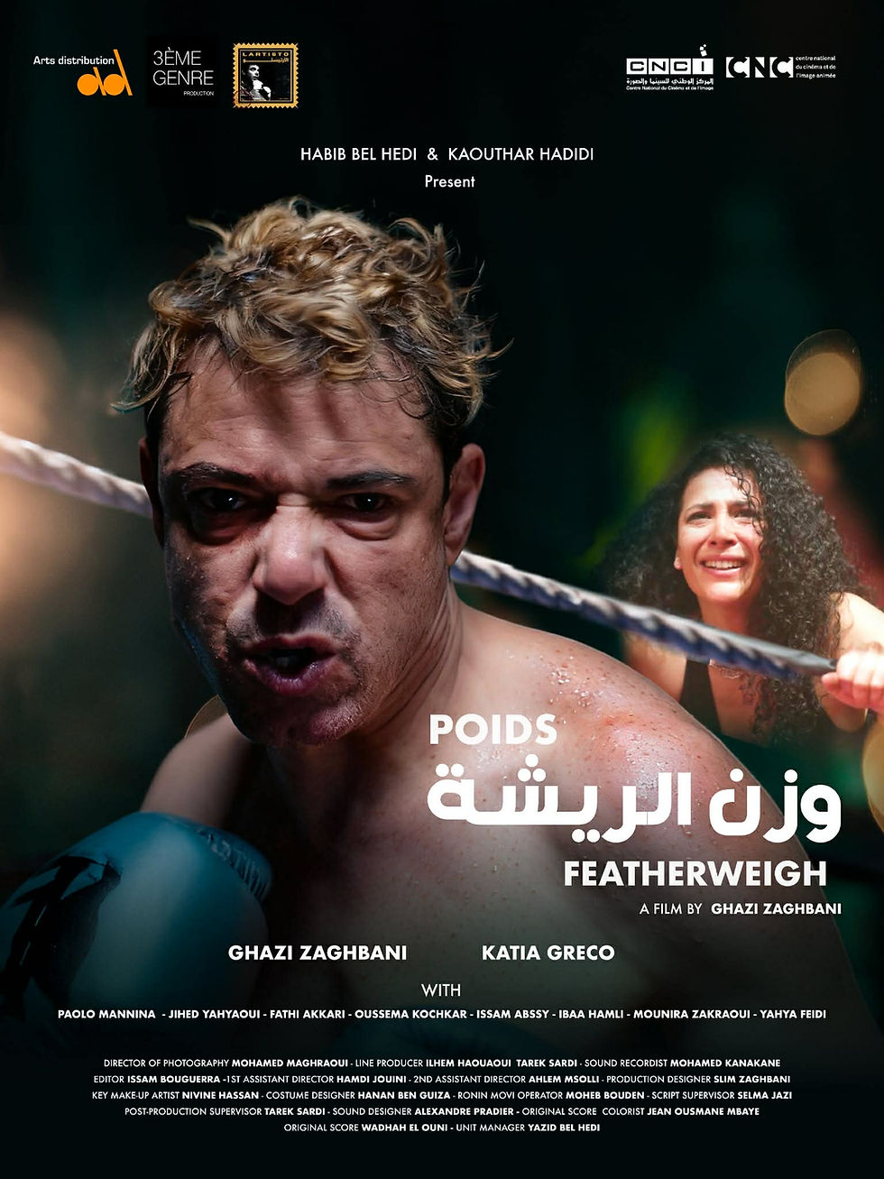 A determined boxer in the ring, wearing blue gloves. Text: "Poids Légers Featherweight." Dark background with a cheering person. Movie of Ghazi Zaghbani with Katia Greco