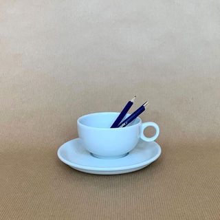 cup and broken pencil