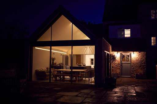 Exterior View Of Beautiful Kitchen Extension At Night.jpg
