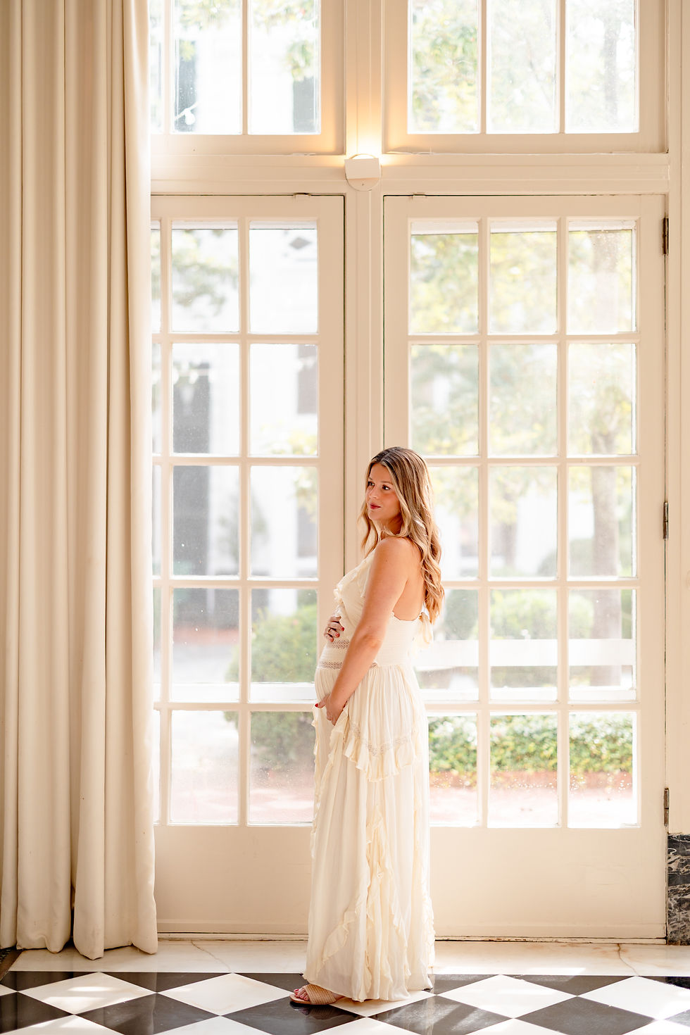 Maternity portrait on the black and white marble floor of the Duke Mansion Solarium in Charlotte NC