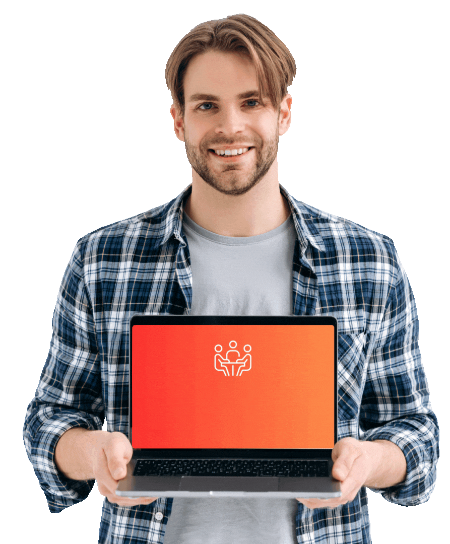 A young man in a plaid shirt smiles while holding a laptop toward the camera. The laptop screen displays a red-to-orange gradient background with a white icon of three people around a table, symbolizing teamwork or collaboration. 