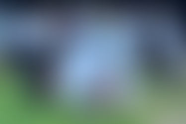 A group of volunteers and staff from Coaches For Charity and Lynx Professional Services posing with a banner for The Johannesburg Children's Home during a Stronger Together youth wellness and fitness outreach event.