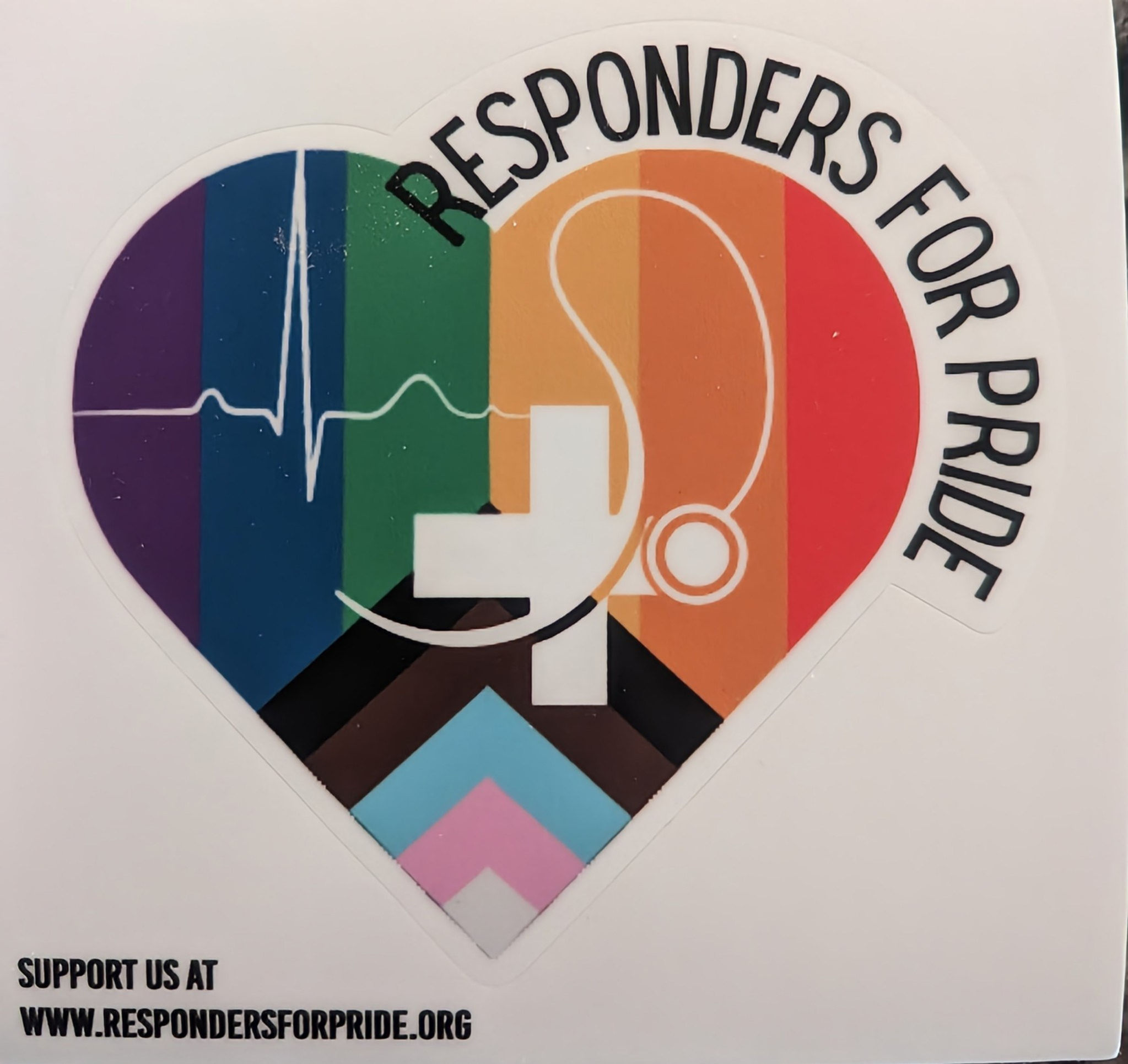 A Heart shaped sticker with progress flag as background. Includes a ECG tracing, with a stethoscope .