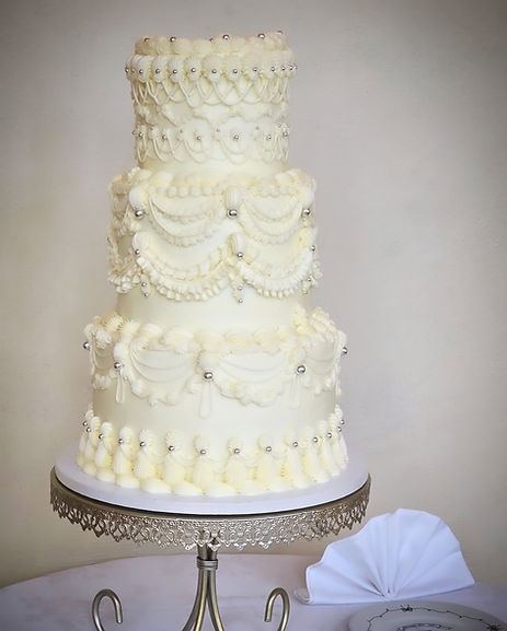 A statuesque 3 tier wedding cake