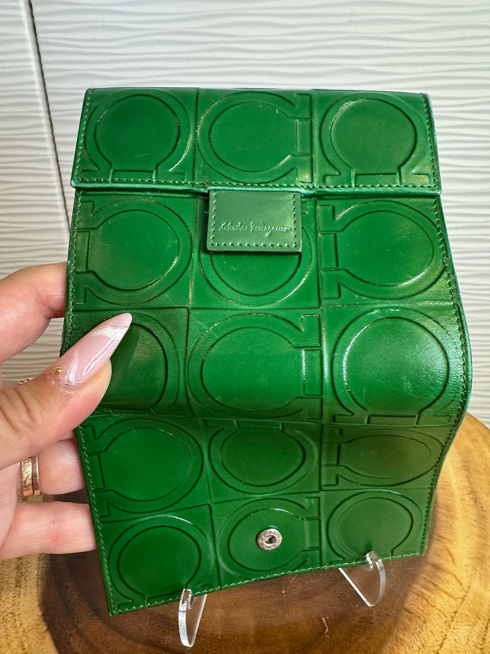 Thumbnail: Green Salvatore Ferragamo Gancini wallet featuring an embossed logo pattern.