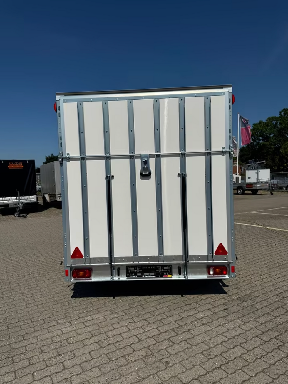 Thumbnail: Rear view of a Stema Enclosed Box Trailer with ramp.