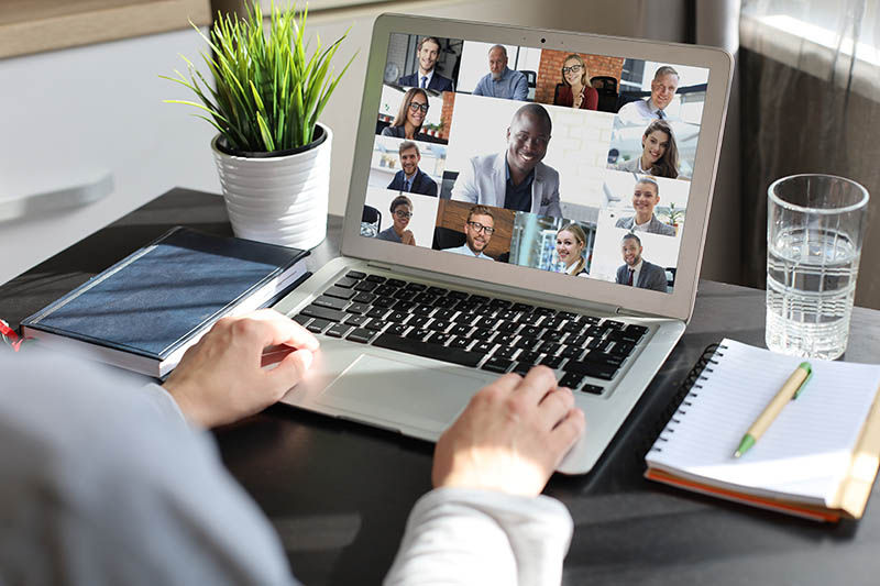 Person using Zoom on a laptop