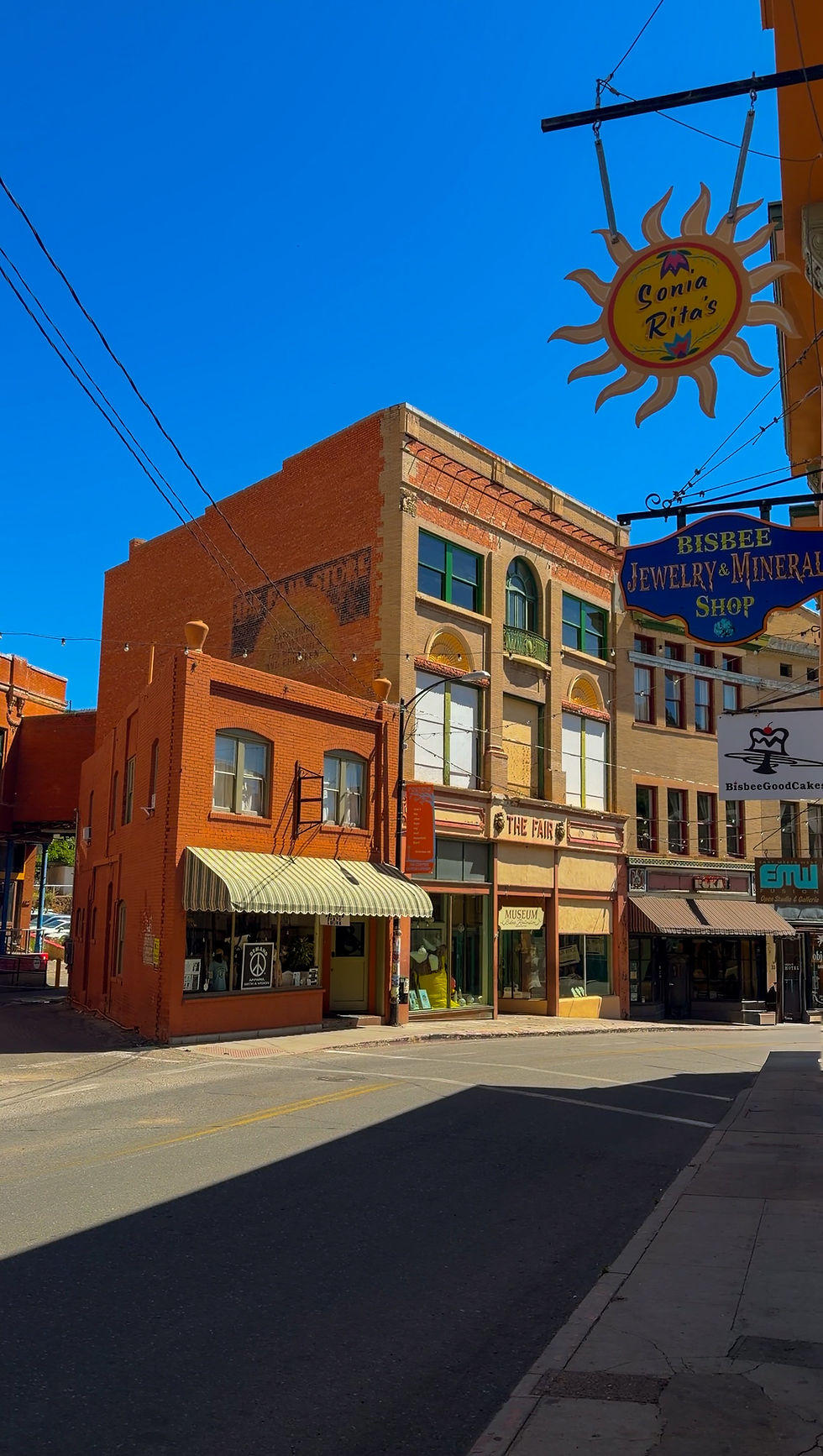 Historic street lined with colorful buildings in downtown Bisbee, Arizona.