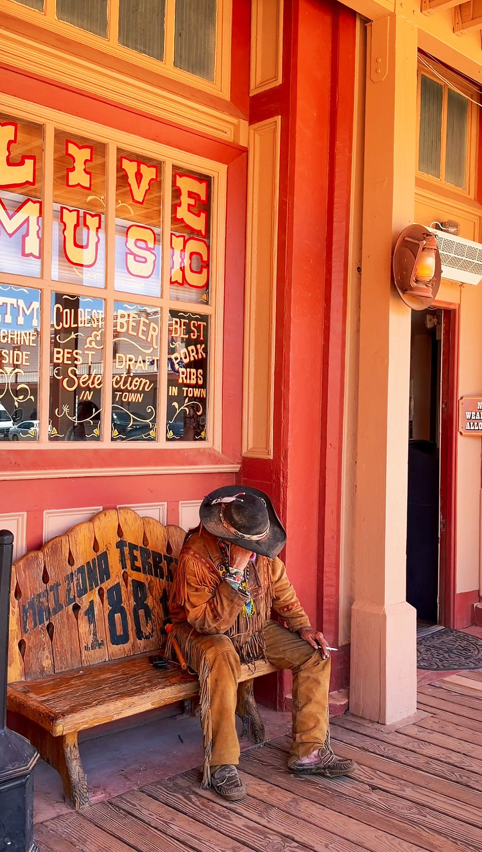 Historic Old West street in Tombstone, Arizona with Western-style buildings and wooden boardwalks