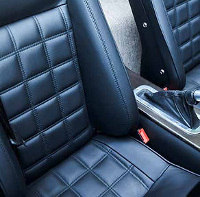 Black pebble-grain leather seats in the Morgan Plus Four